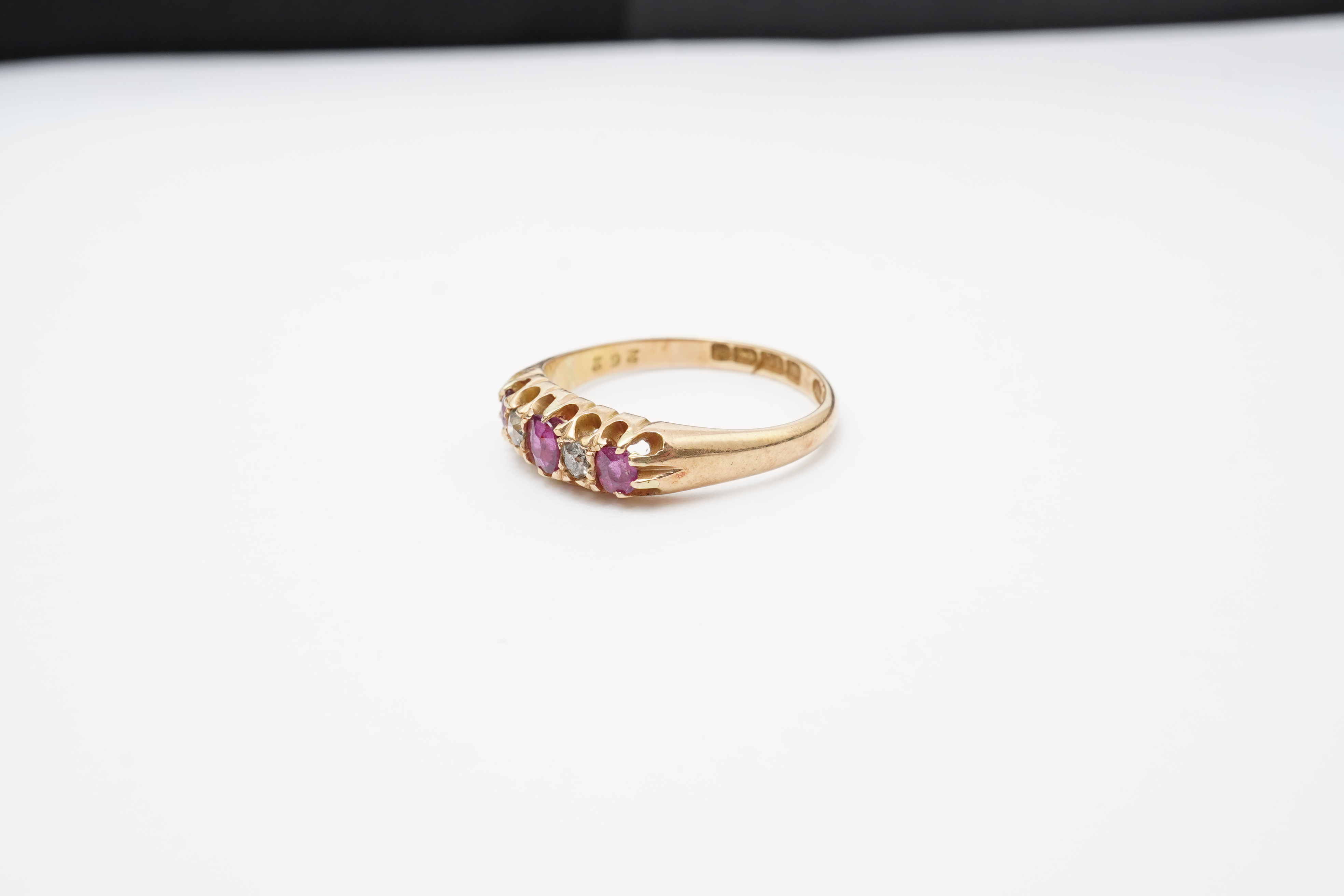 A ruby and diamond five-stone ring, circa 1900